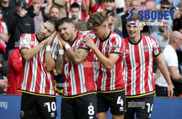 Sheffield United players celebrate after Gustavo Hamer's goal